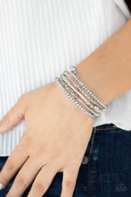 Load image into Gallery viewer, Head-Turning Twinkle - Silver coil bracelet 2040
